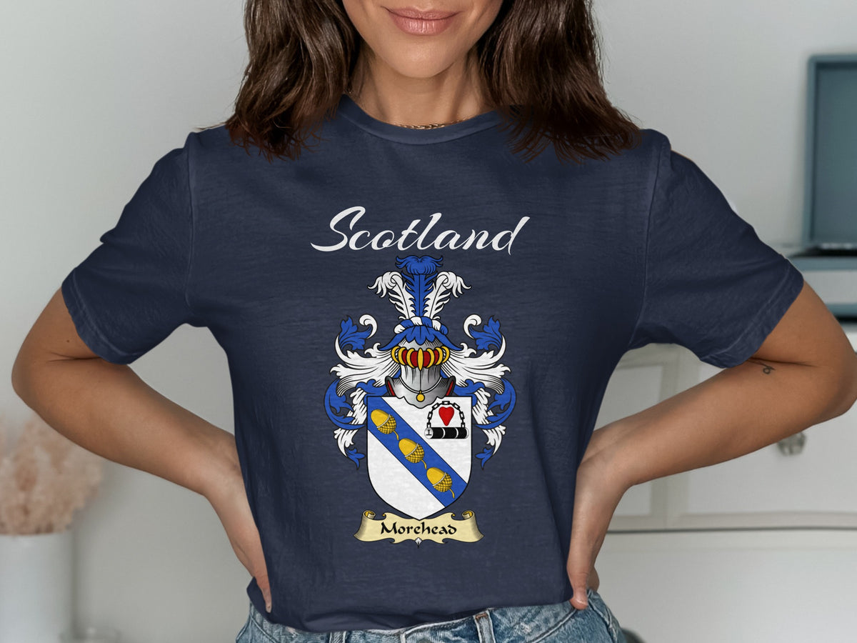 Model wearing a navy Morehead T-shirt featuring a blue diagonal band with gold motifs