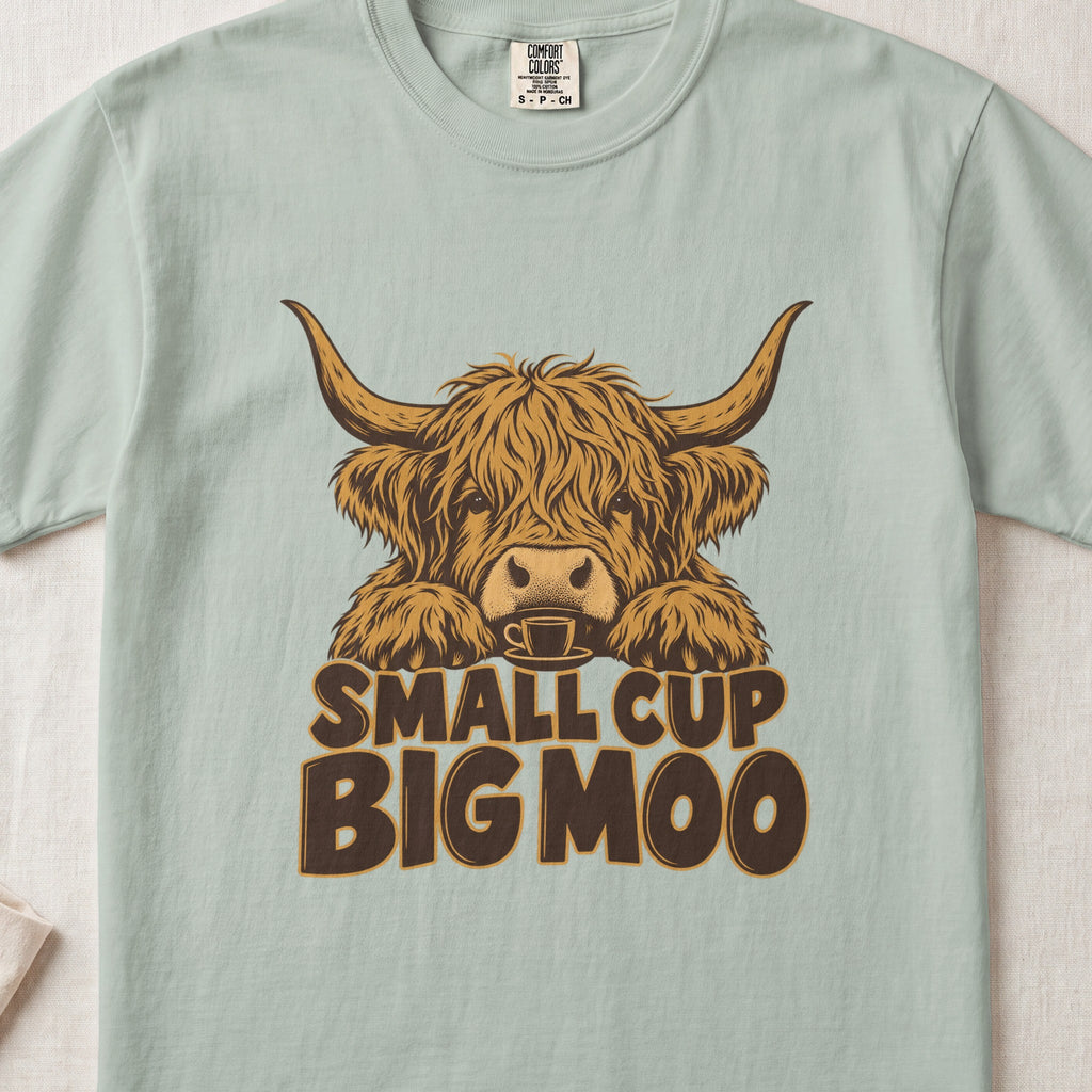 Small Cup, Big Moo Highland cow design on a Bay Comfort Colors 1717 T-shirt, flat lay