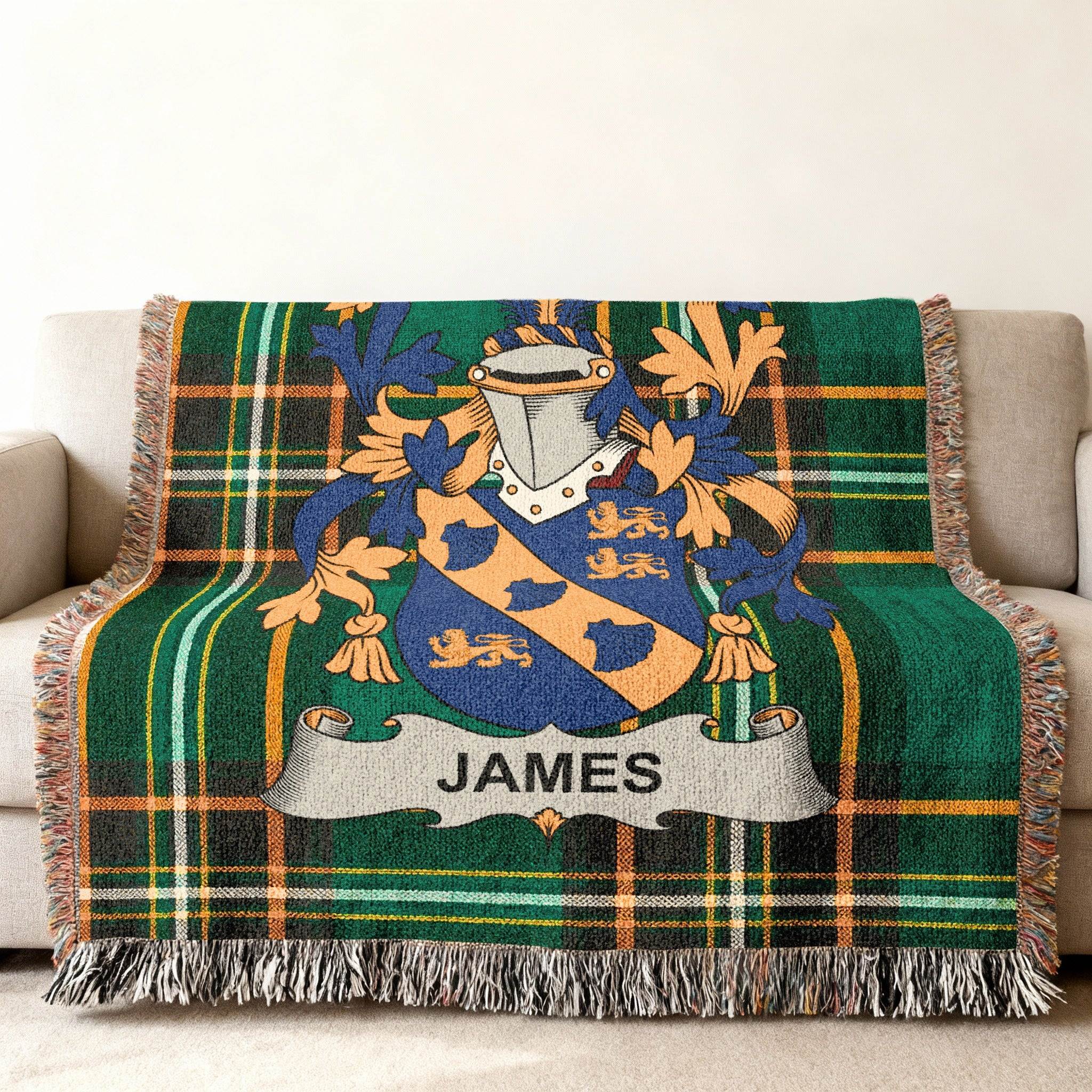 Green plaid blanket with the James family crest in the center.