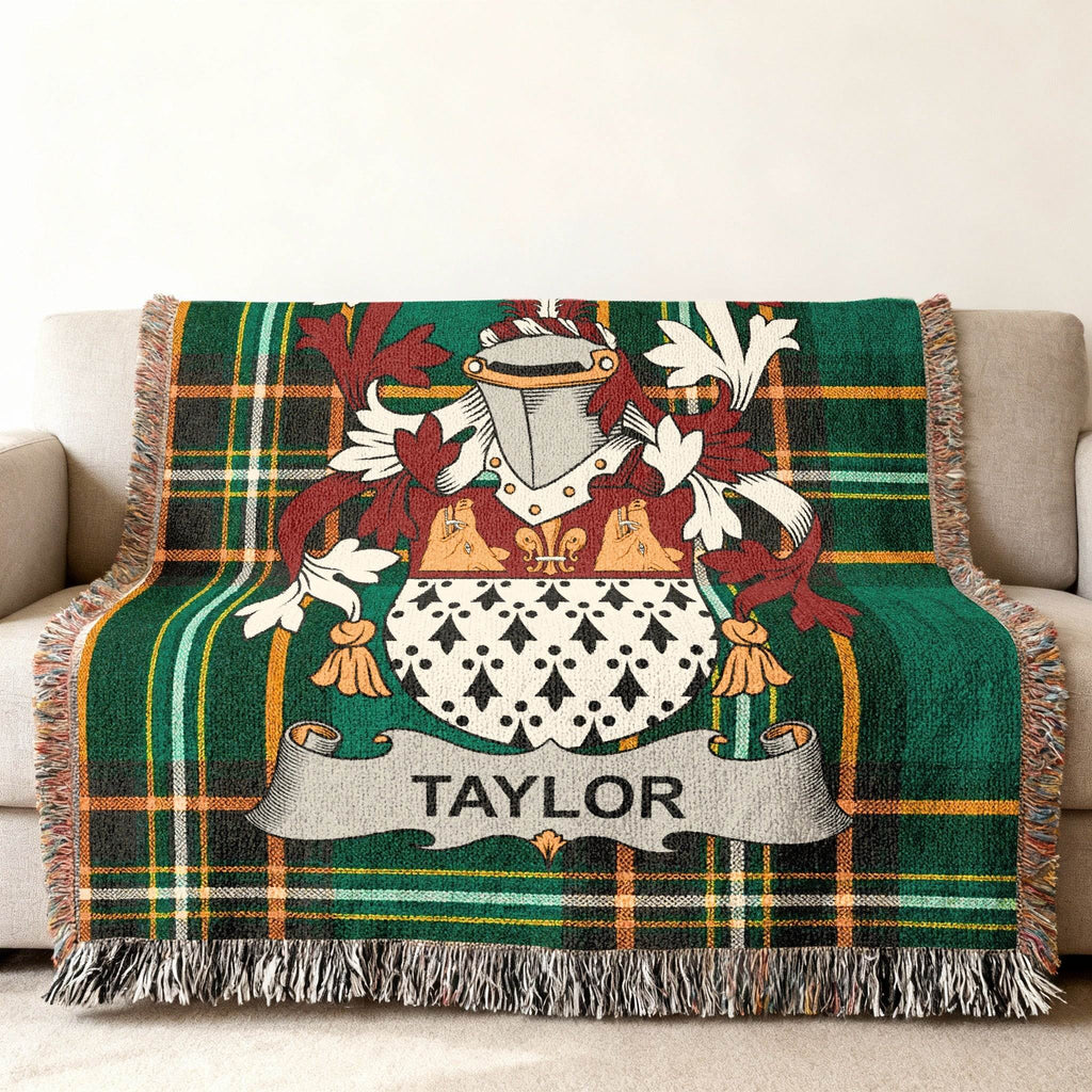 Tartan blanket with Taylor family crest in the center.