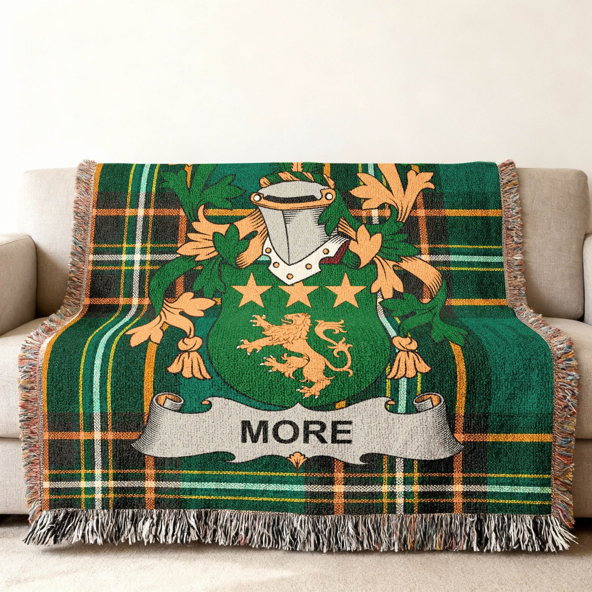 More family crest on a green plaid woven throw blanket.
