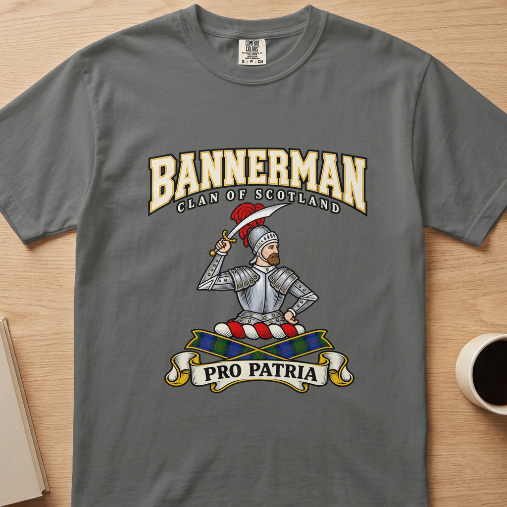 Bannerman armored figure and raised sword graphic on a charcoal gray Comfort Colors T-shirt, front view