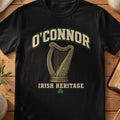 O'Connor Irish harp T-shirt in Black, with cream surname lettering, a gold-toned harp, green shamrock and “Irish Heritage” text.