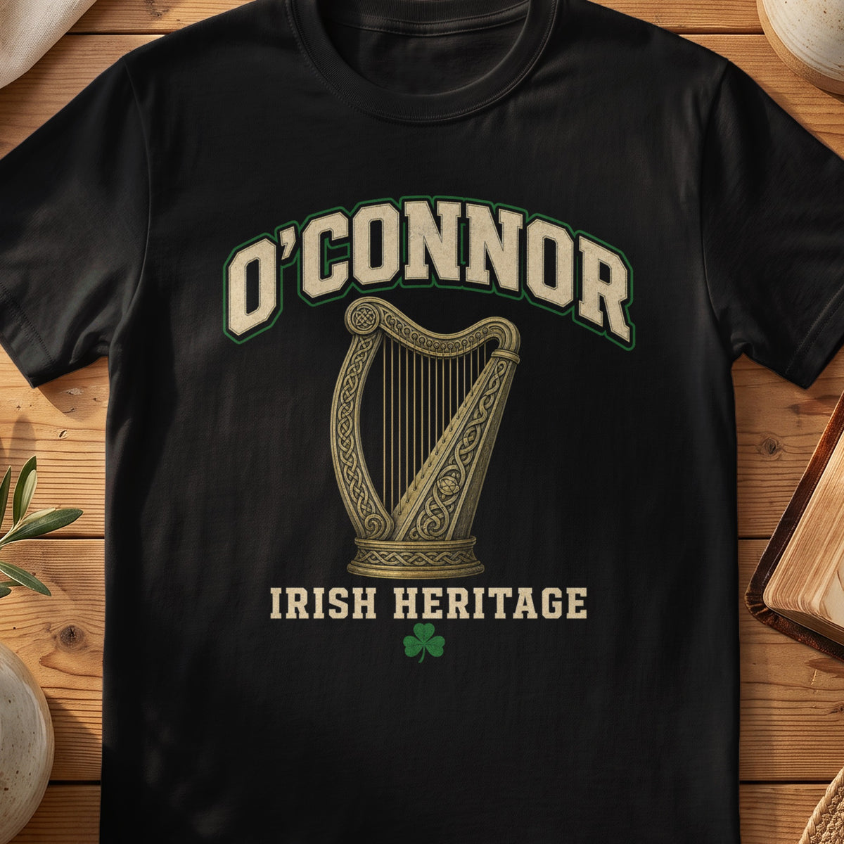O'Connor Irish harp T-shirt in Black, with cream surname lettering, a gold-toned harp, green shamrock and “Irish Heritage” text.