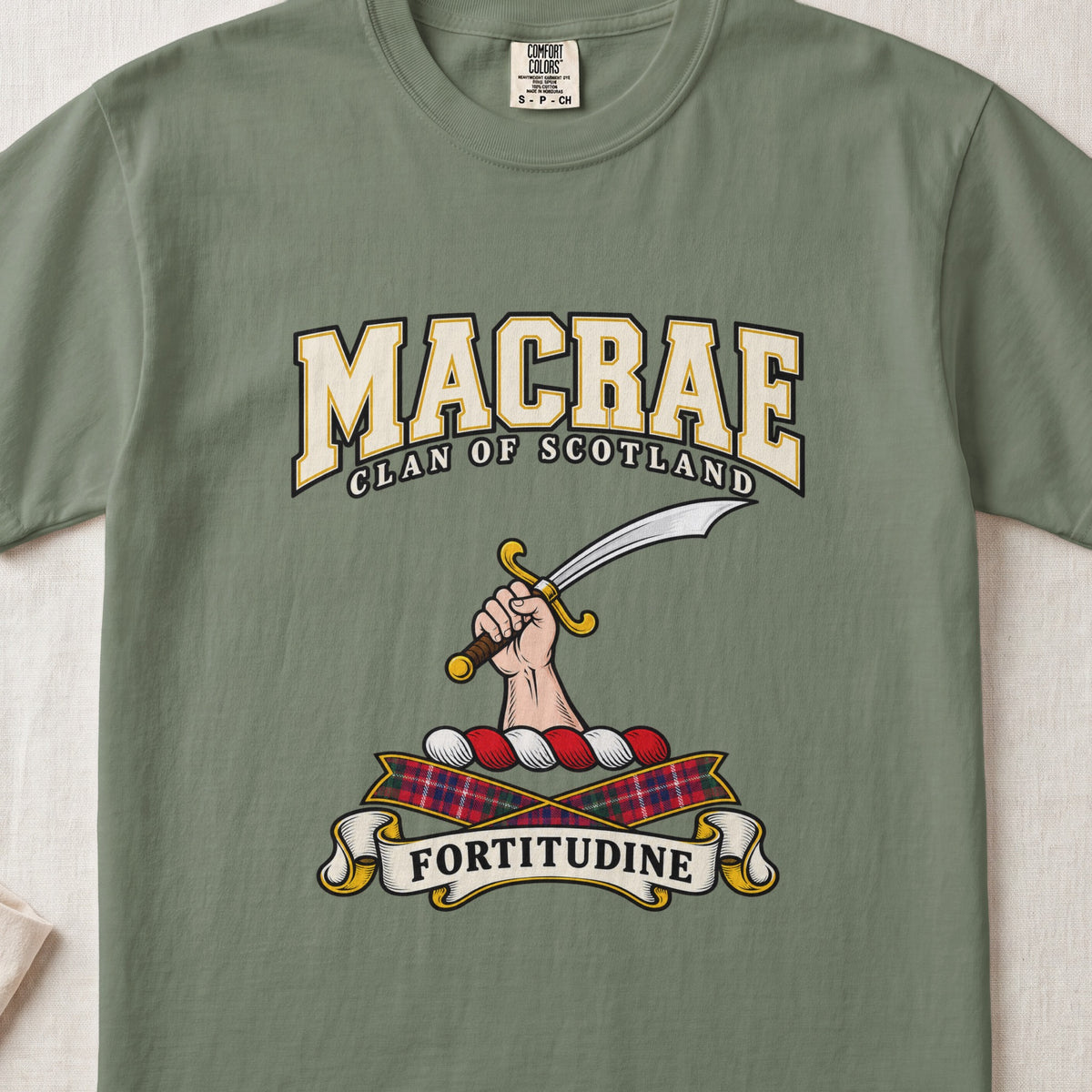 MacRae graphic T-shirt in Moss green, front flat lay showing varsity lettering and hand and forearm holding a curved silver sword with a gold hilt.