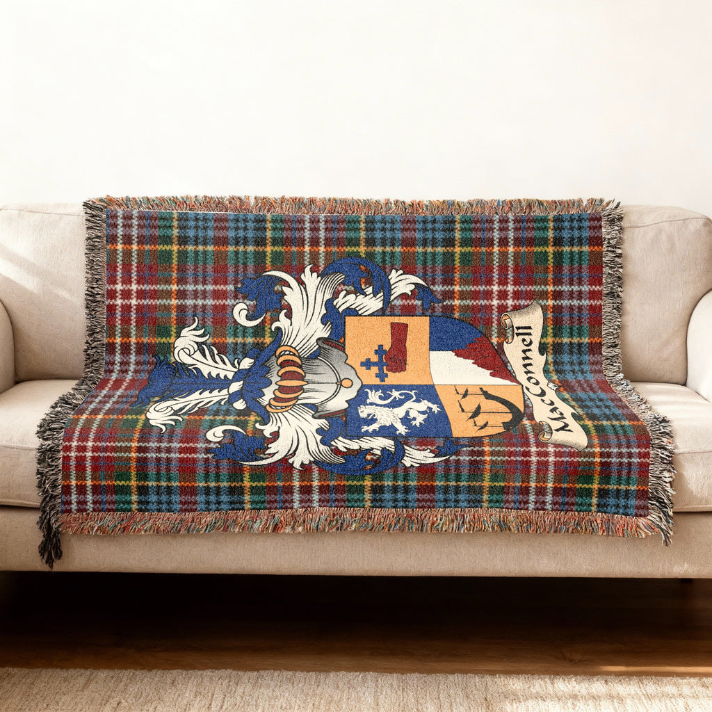 MacConnell Scottish woven blanket with family shield and Caledonia tartan background