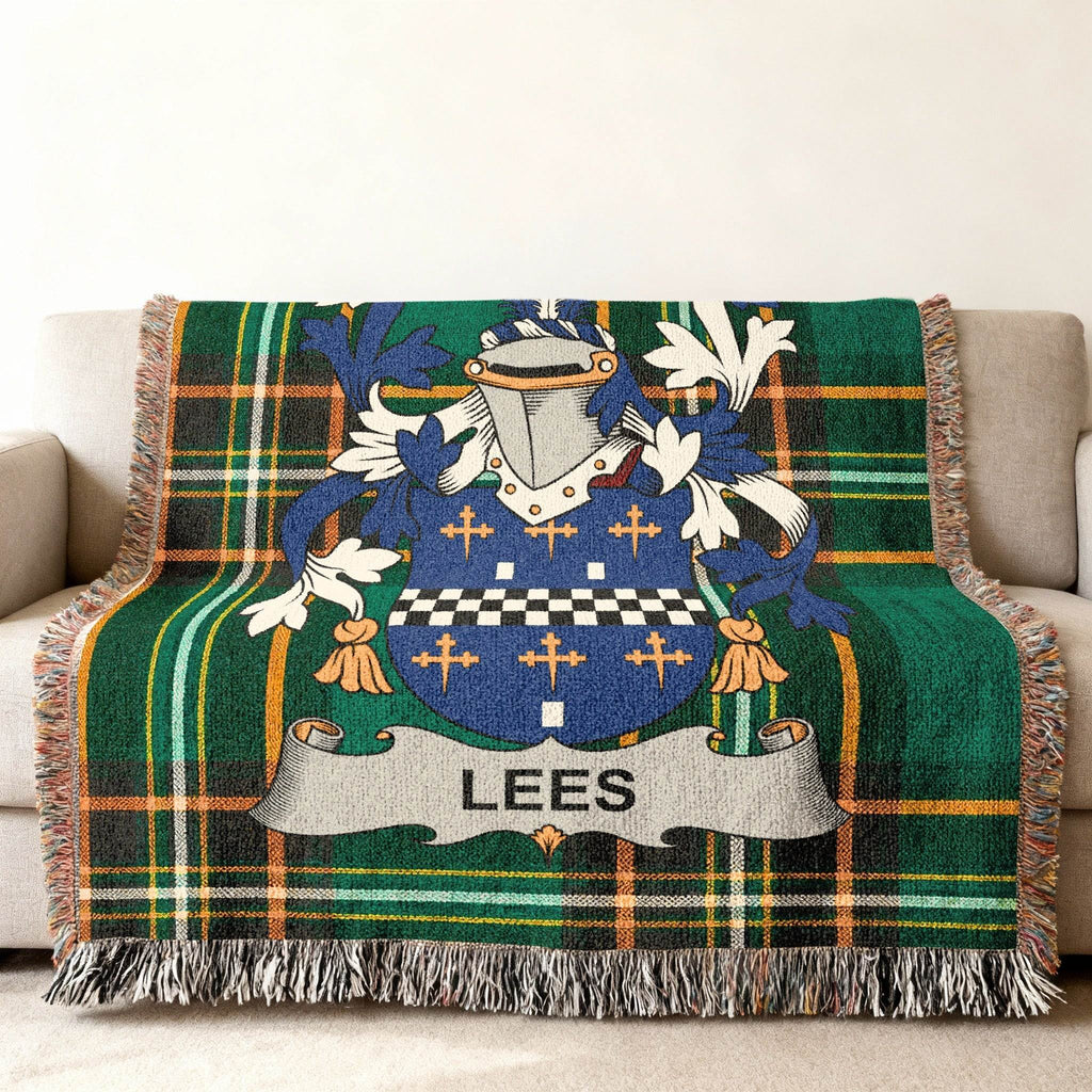 Tartan blanket with Lees family crest in blue, green, and white.