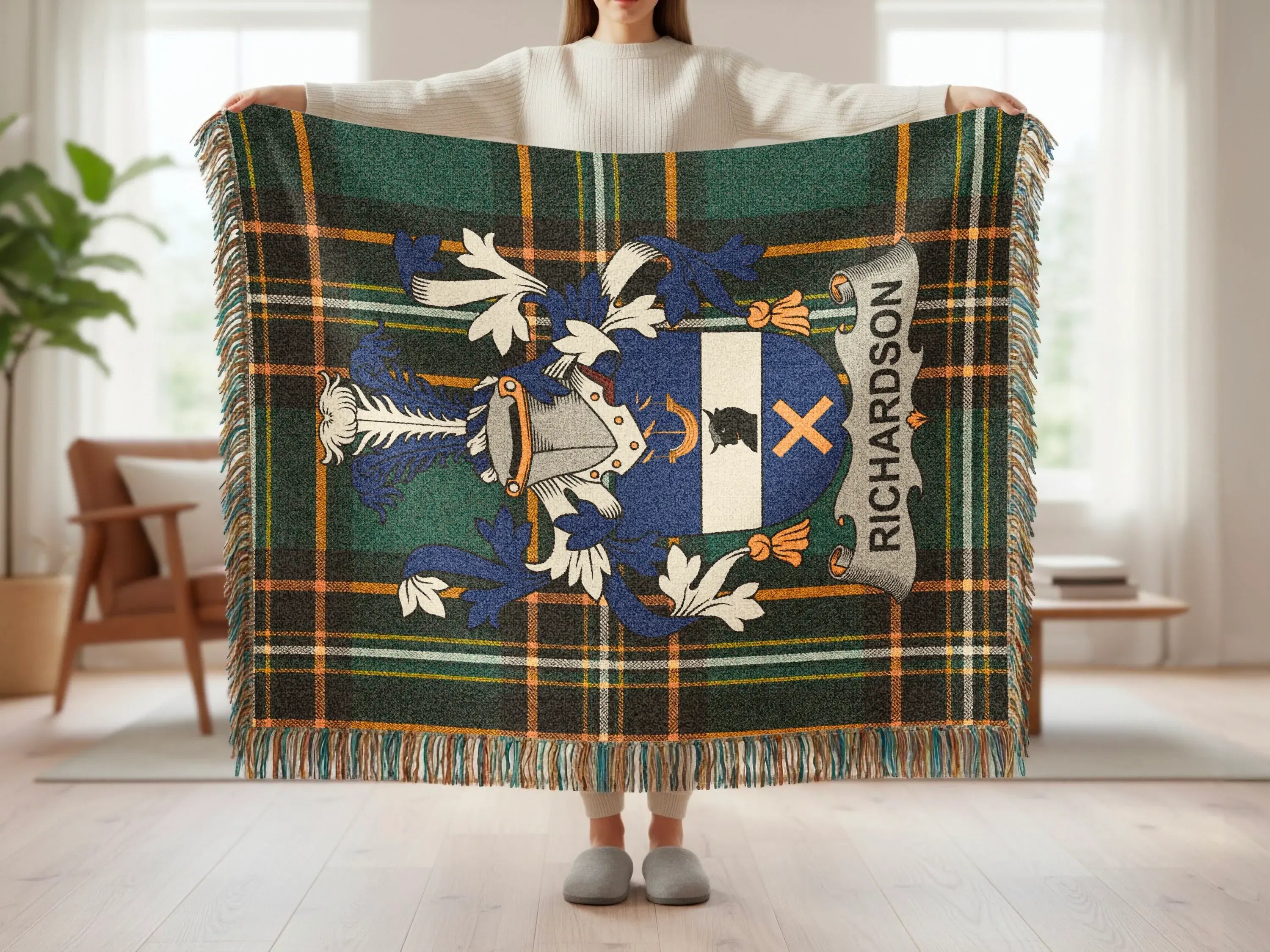 Plaid blanket with Richardson family crest displayed.