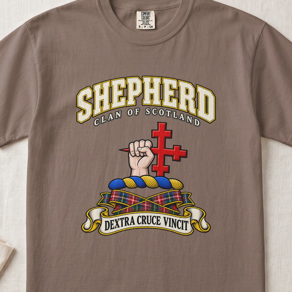 Shepherd Scottish clan T-shirt in Espresso, front view with a hand holding a red cross and motto banner.