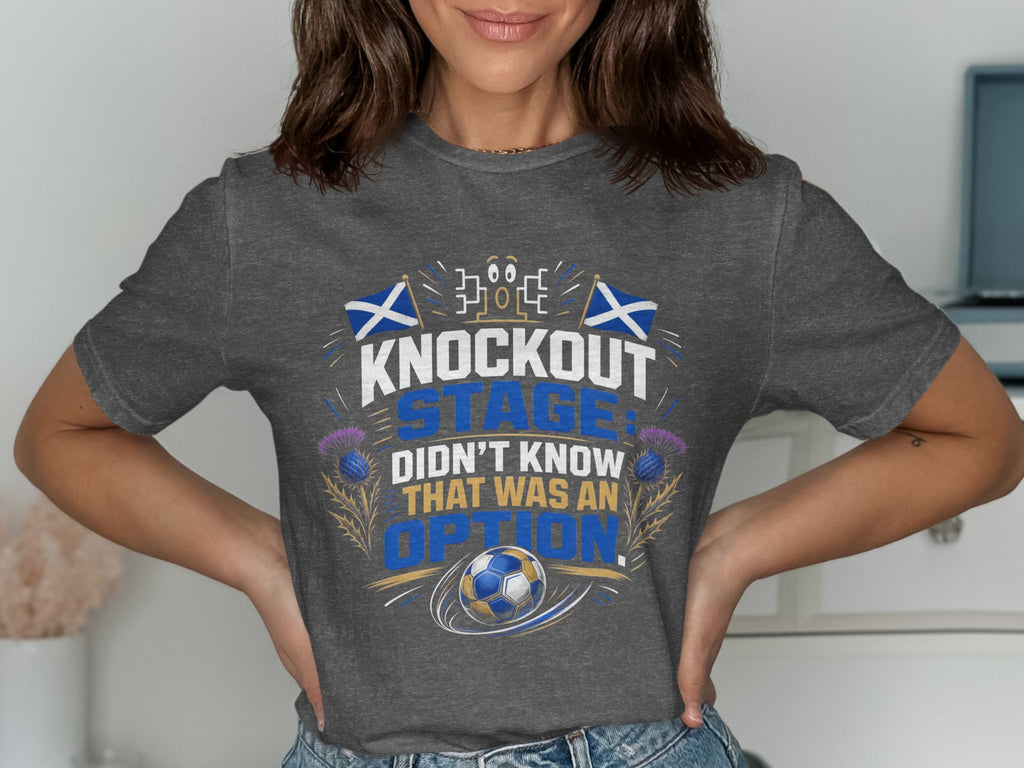 Grey t-shirt with "Knockout Stage Didn't Know That Was An Option" text and soccer ball.