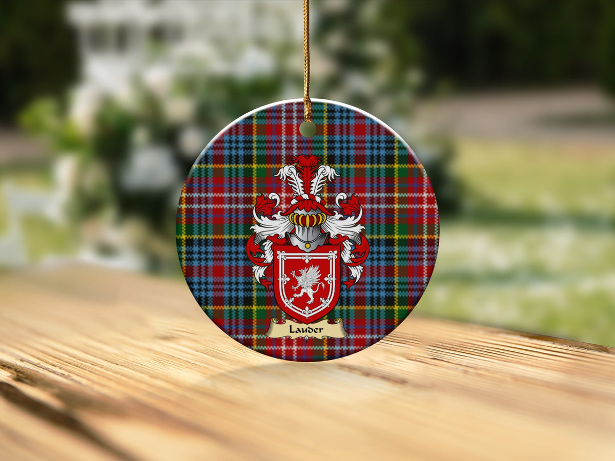 Round Lauder Scottish clan ornament with family crest on a Caledonia tartan background