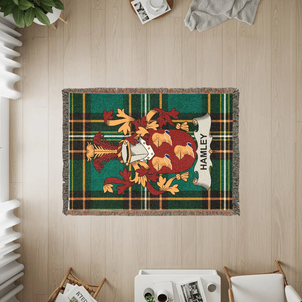 Tapestry with plaid pattern, a coat of arms, and "HAMLEY" text.