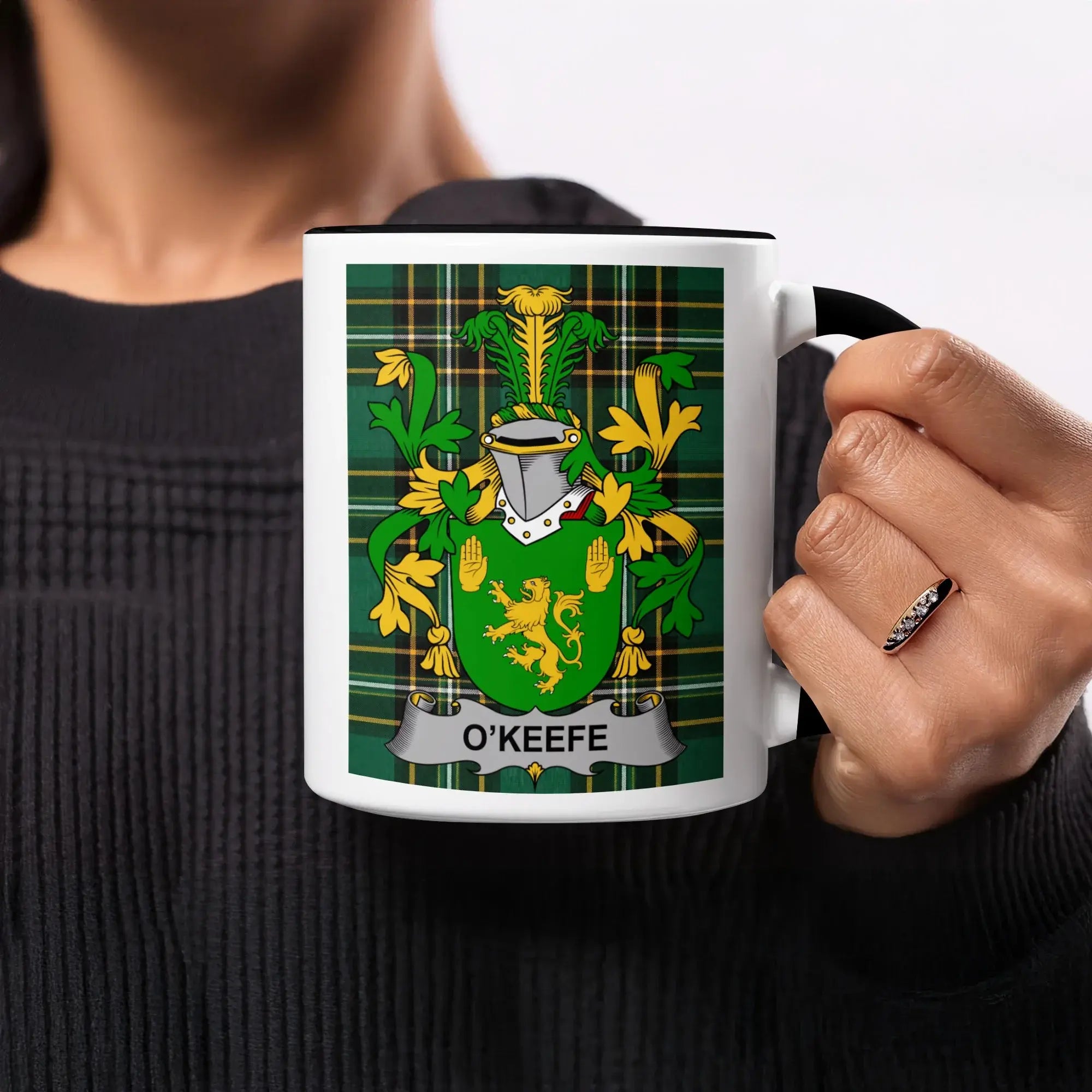 O'Keefe family crest on a white mug with a black handle.