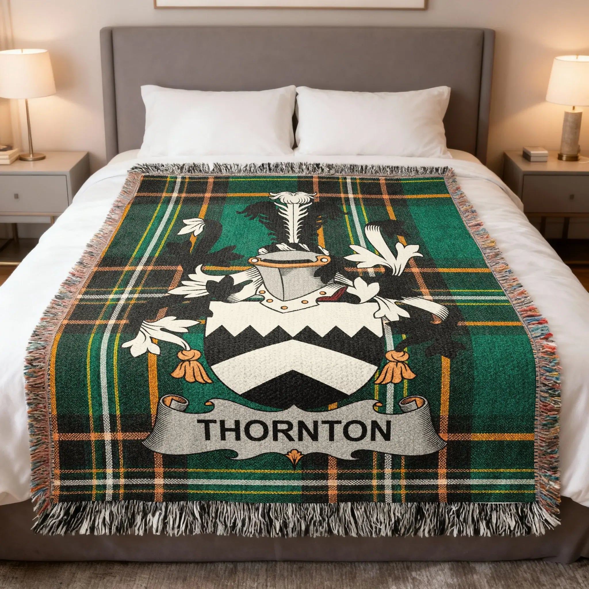 Thornton clan crest on a green plaid woven blanket with fringed edges.