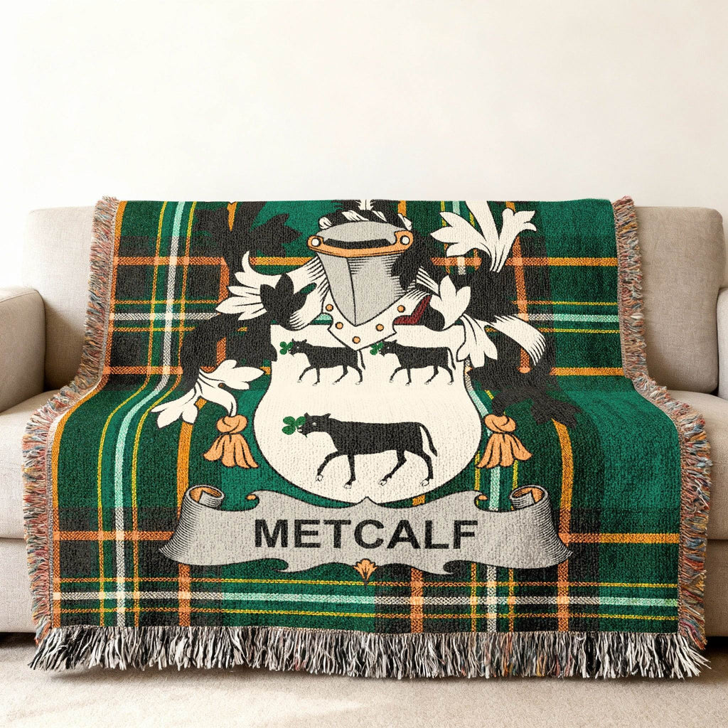 Green tartan throw blanket with Metcalfe coat of arms.