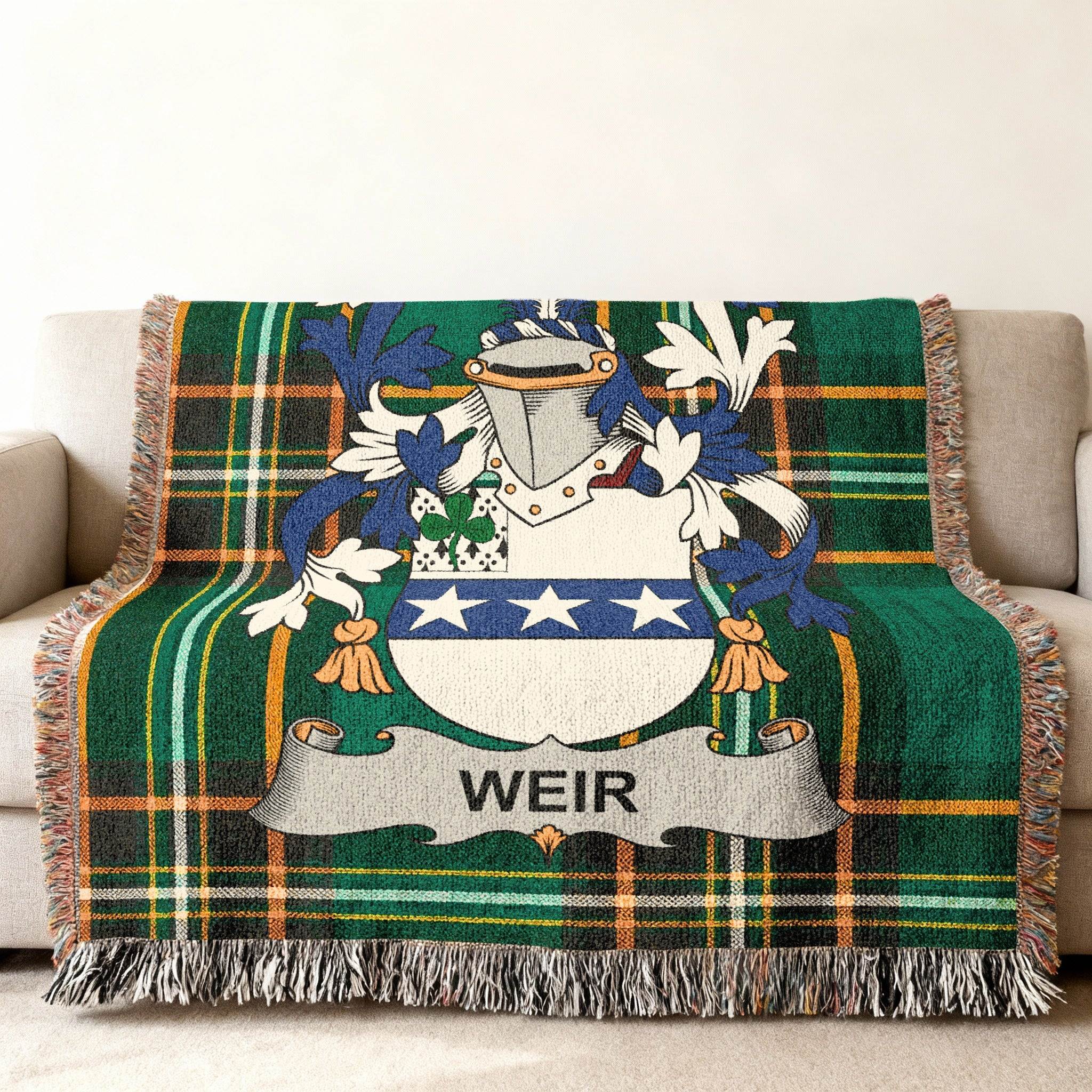 Woven plaid throw blanket featuring a Weir family crest with a banner.