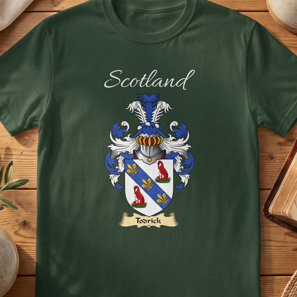 Forest Green Todrick Scottish T-shirt laid flat with coat of arms artwork and “Scotland” text.