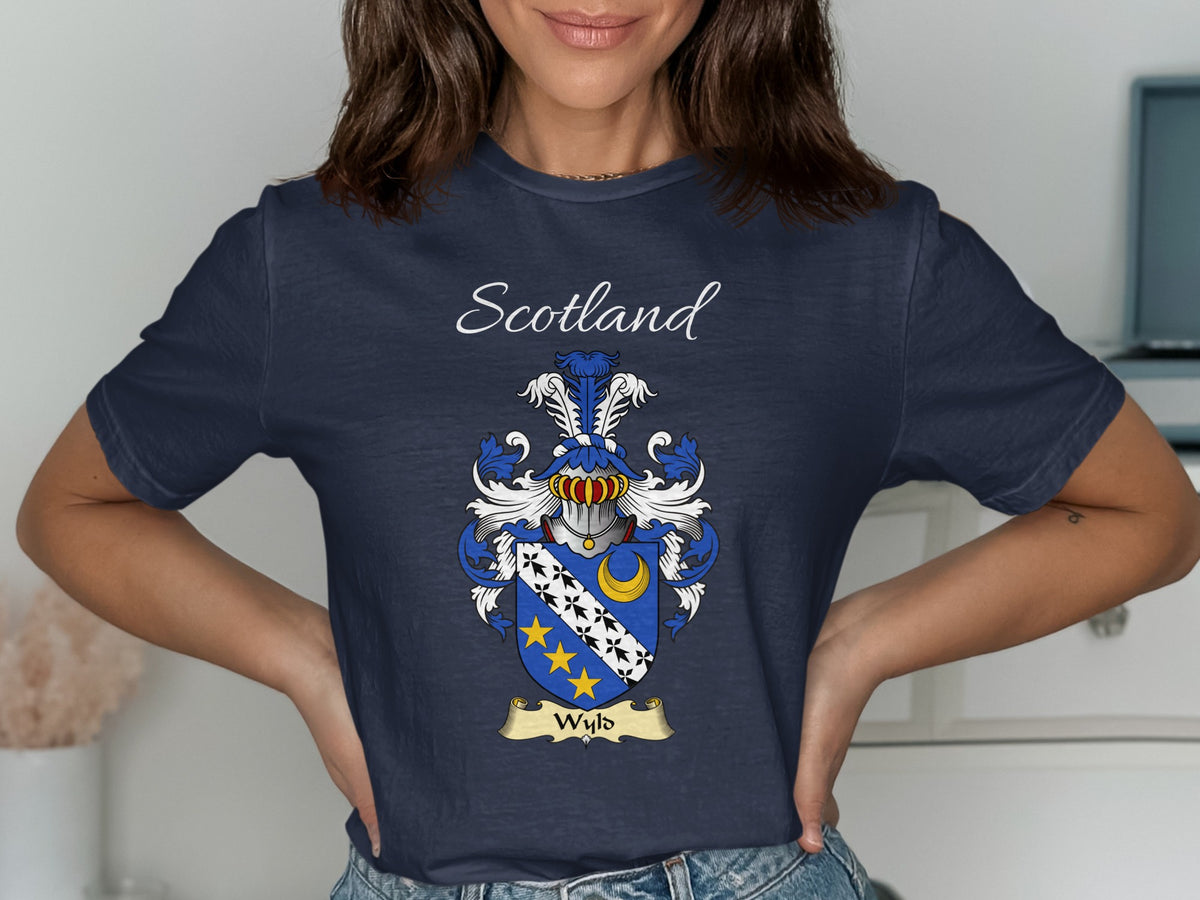 Model wearing the navy Wyld family crest T-shirt featuring “Scotland” and the surname banner.
