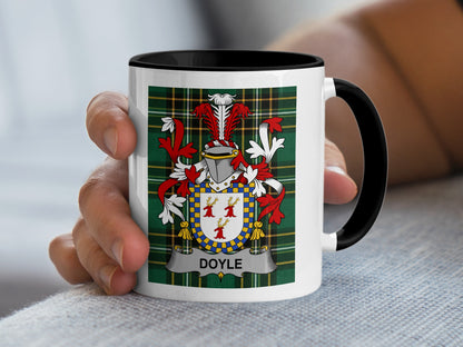 White mug with black rim featuring the Doyle family crest on tartan background.