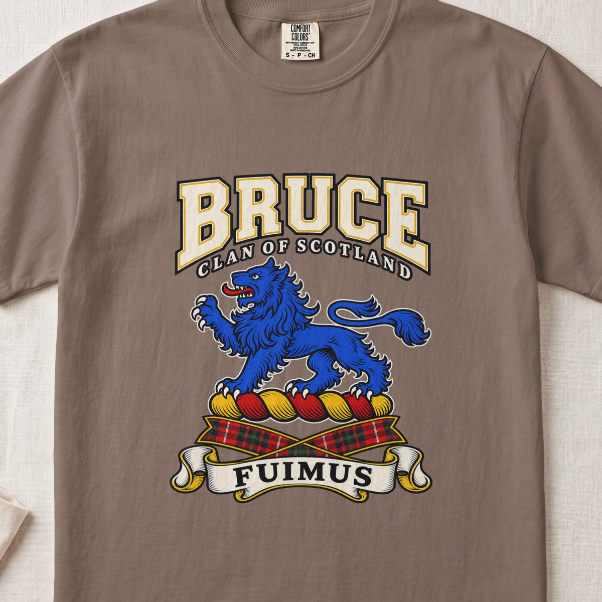 Espresso Bruce Scottish clan T-shirt, front flat lay with varsity lettering, blue lion crest and Fuimus motto.
