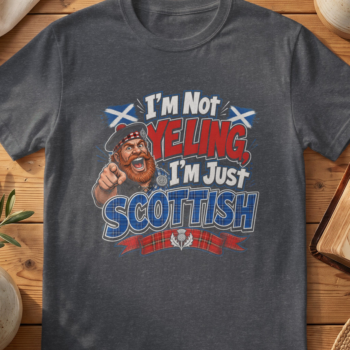 Dark grey Gildan 64000 unisex T-shirt flatlay with I'm Not Yelling I'm Just Scottish Scottish graphic design