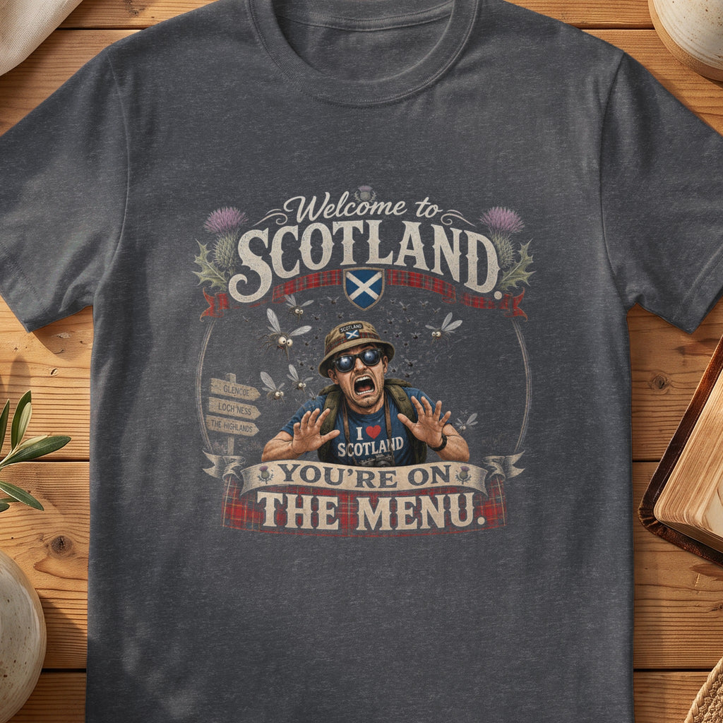 Dark grey Gildan 64000 unisex T-shirt flatlay with Welcome to Scotland You're on the Menu Scottish graphic design