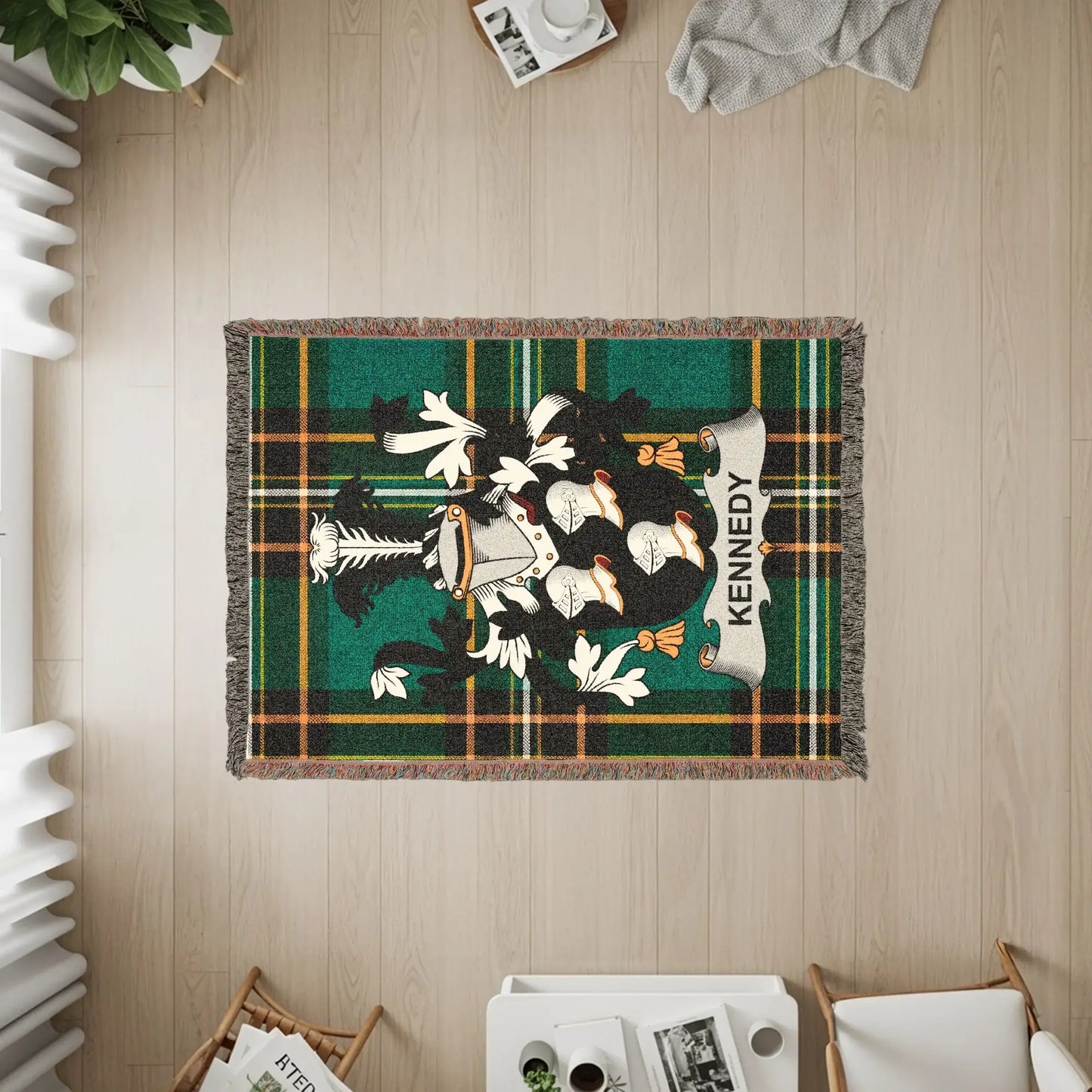 Kennedy tartan throw blanket with family crest in center.