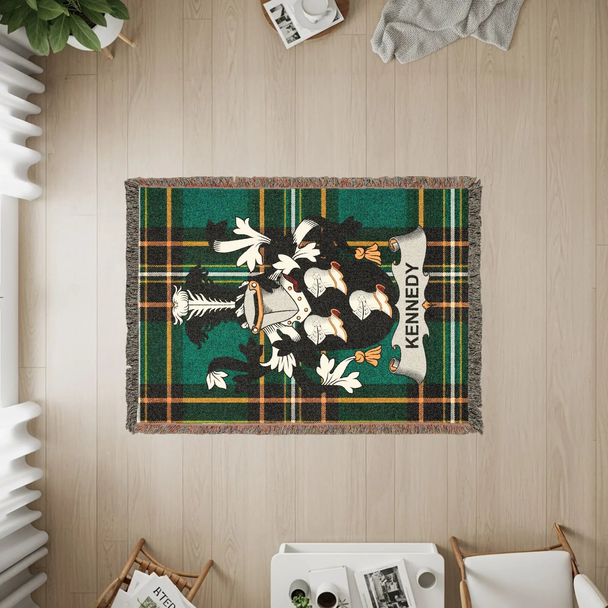 Kennedy tartan throw blanket with family crest in center.