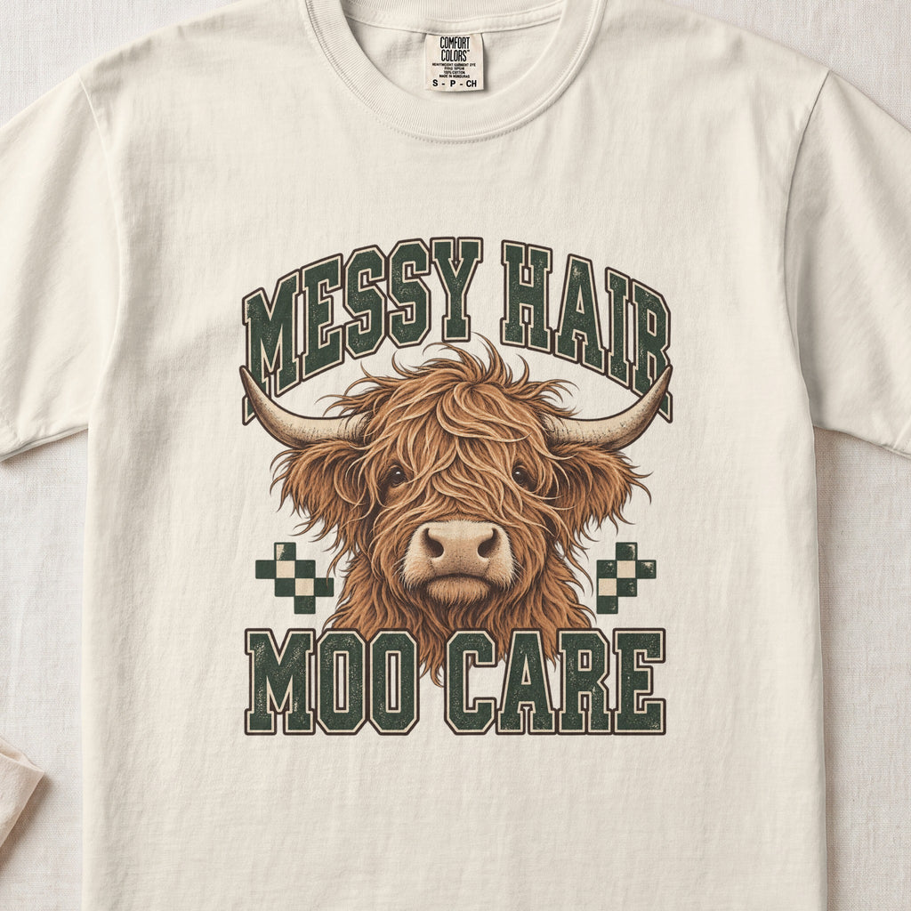 Messy Hair, Moo Care Highland cow design on an Ivory Comfort Colors 1717 T-shirt, flat lay