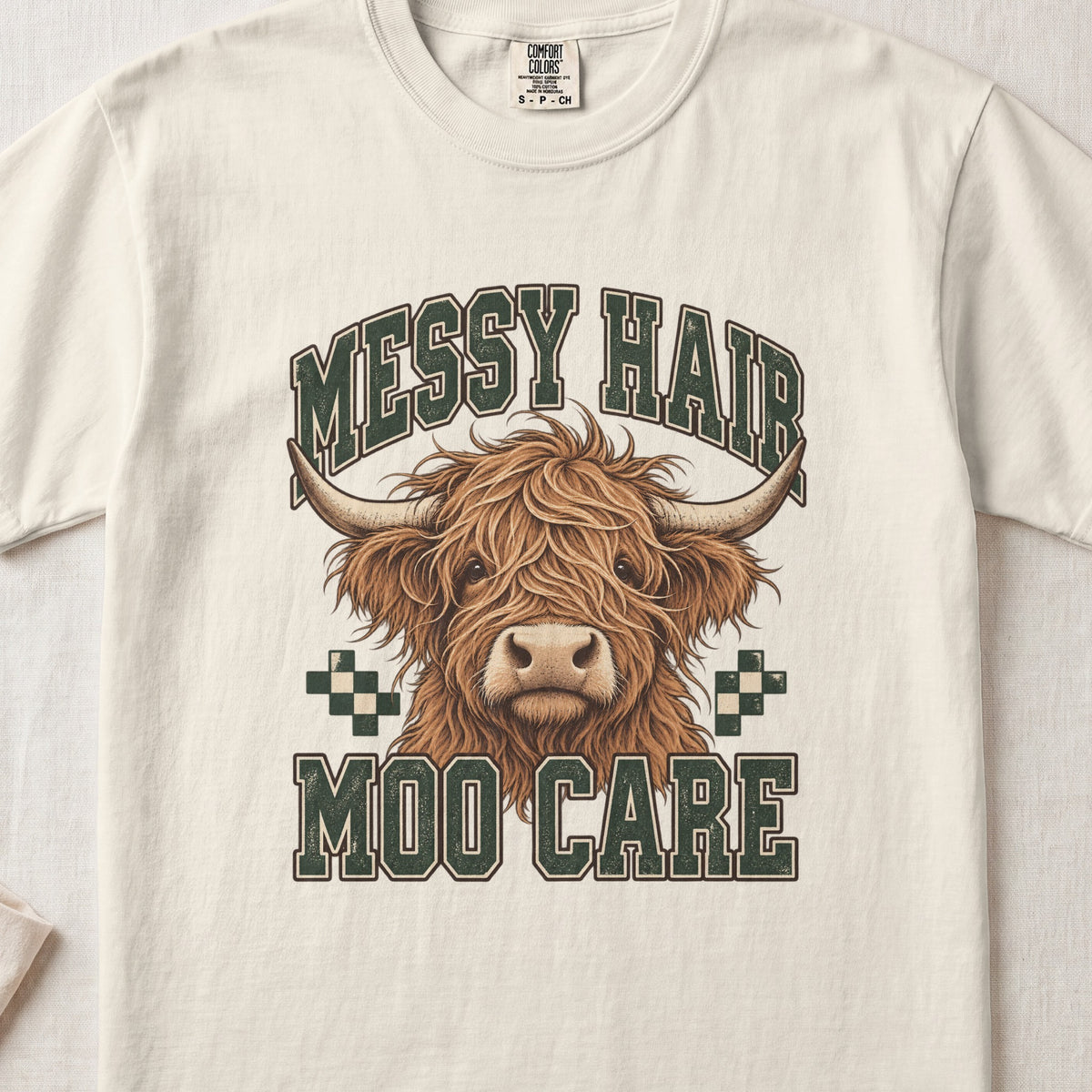 Messy Hair, Moo Care Highland cow design on an Ivory Comfort Colors 1717 T-shirt, flat lay