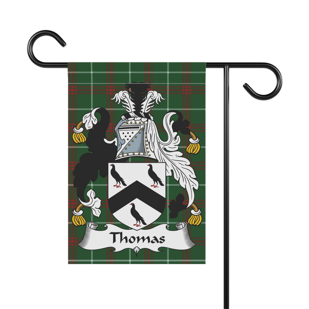 Thomas family crest on a plaid garden flag mounted on a black metal stand.