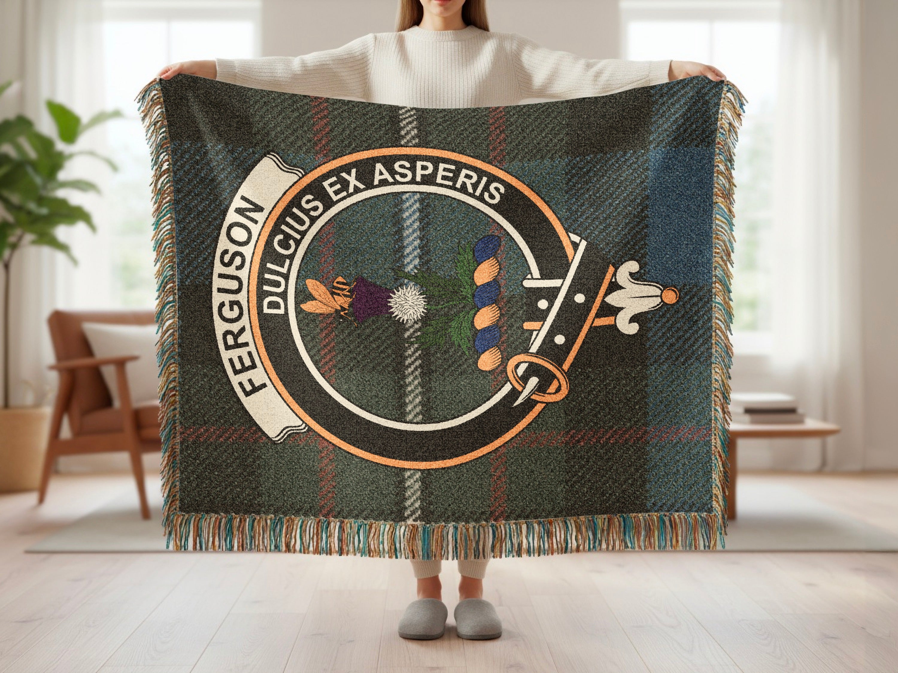 Ferguson tartan woven blanket with clan crest and fringe held up full view