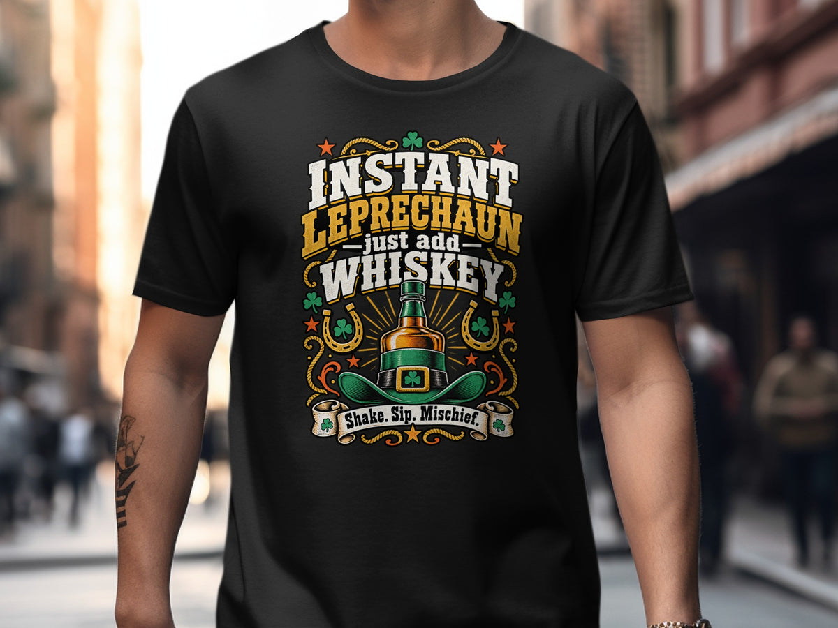 Black funny Irish T-shirt reading “Instant Leprechaun Just Add Whiskey – Shake. Sip. Mischief.”