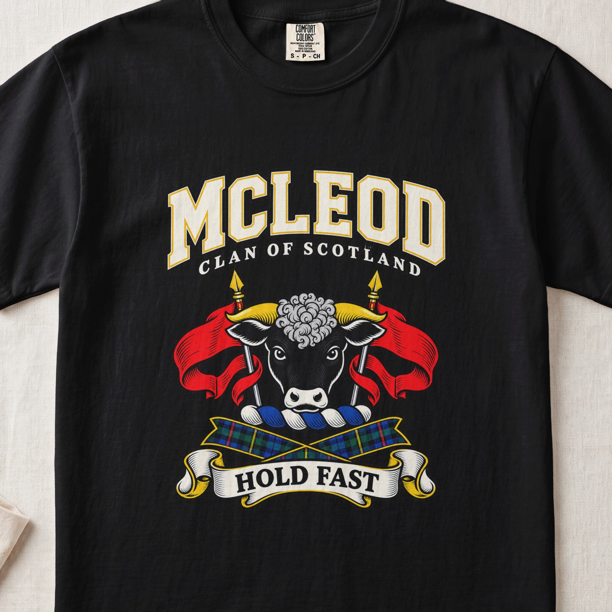 McLeod graphic T-shirt in Black, front flat lay showing varsity lettering and black bull head with white muzzle and curly white forelock.