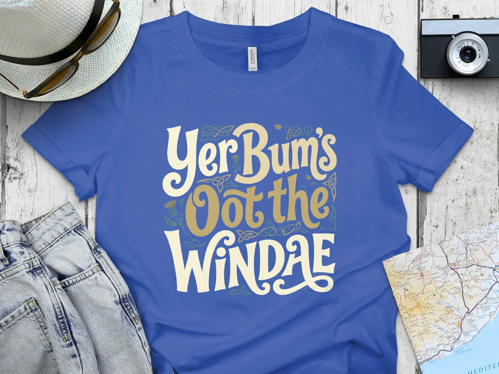 Blue t-shirt with "Yer Bum's Oot the WINDAE" text in yellow and green.