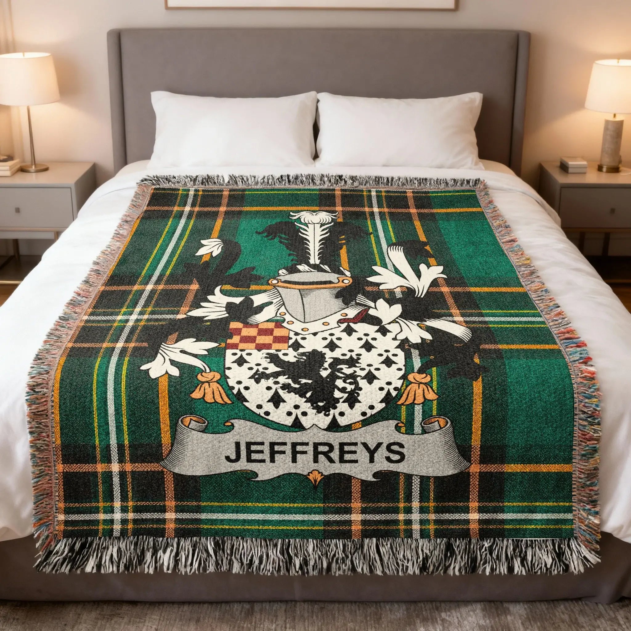 Green plaid blanket with a coat of arms and "JEFFREYS" banner on a bed.