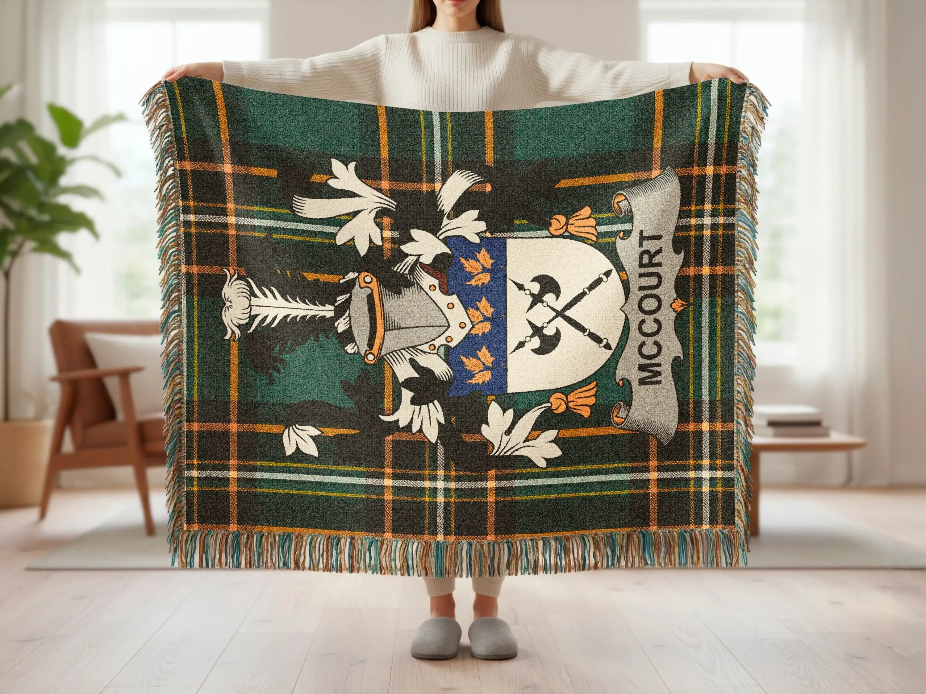 Tartan blanket with a family crest and the name "MCCOURT".