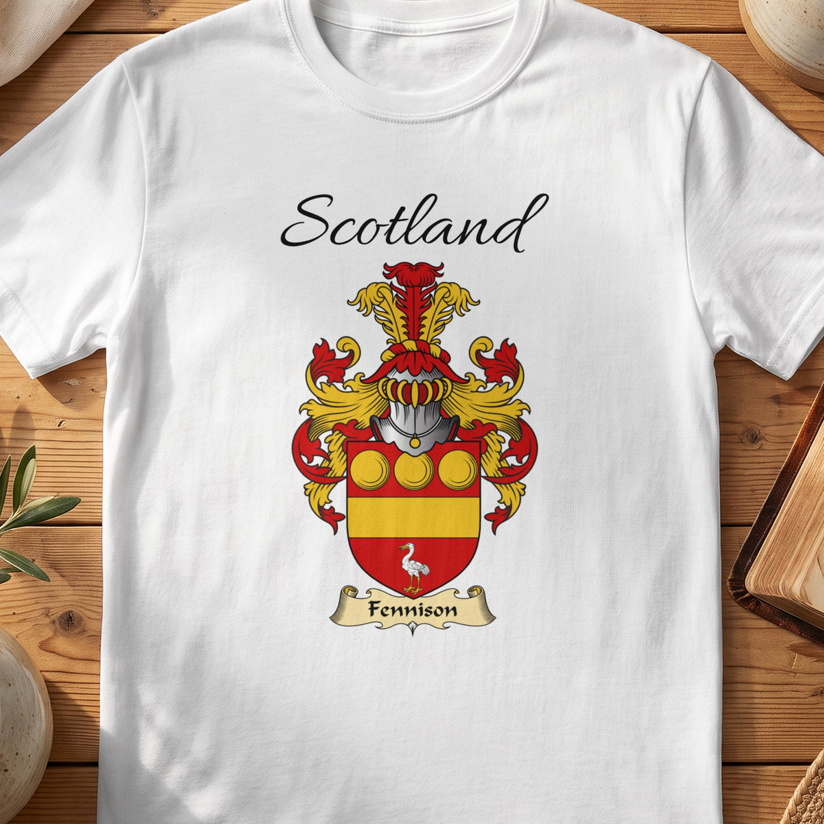 White Fennison Scottish family shield T-shirt featuring gold roundels and a gold band on red