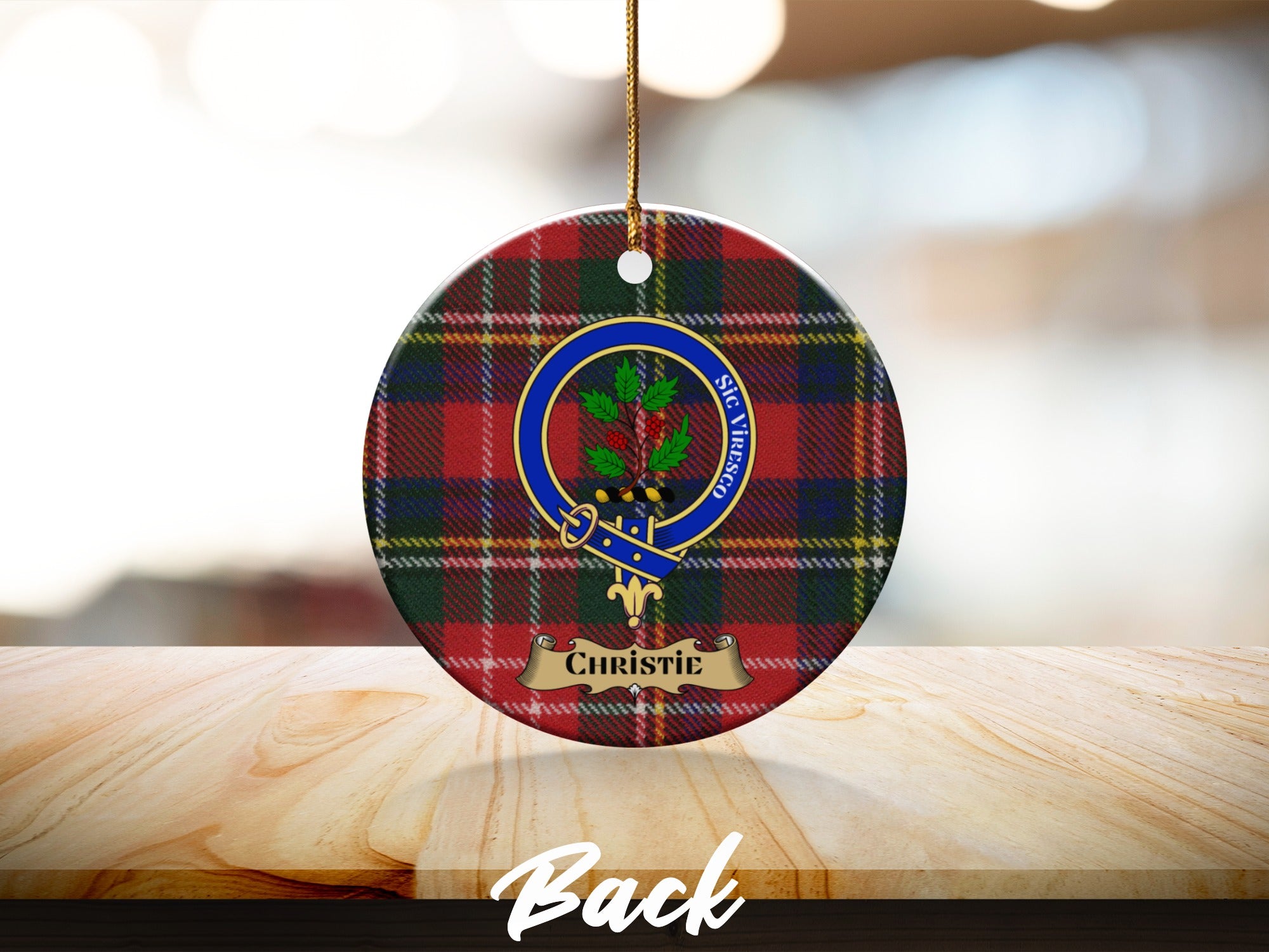 Christie name and clan crest on round red tartan ceramic ornament