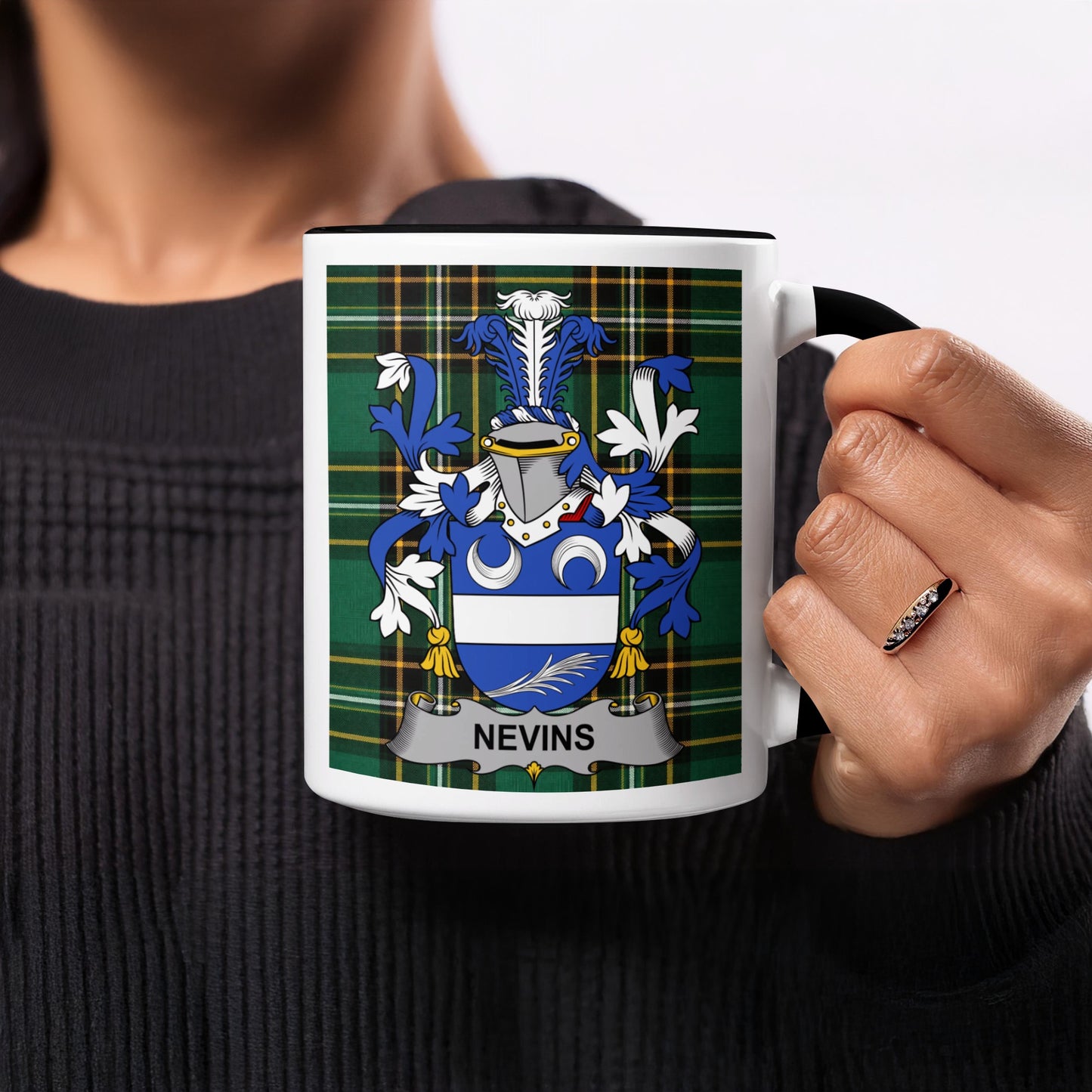 Mug with the Nevins family crest on a green plaid background.