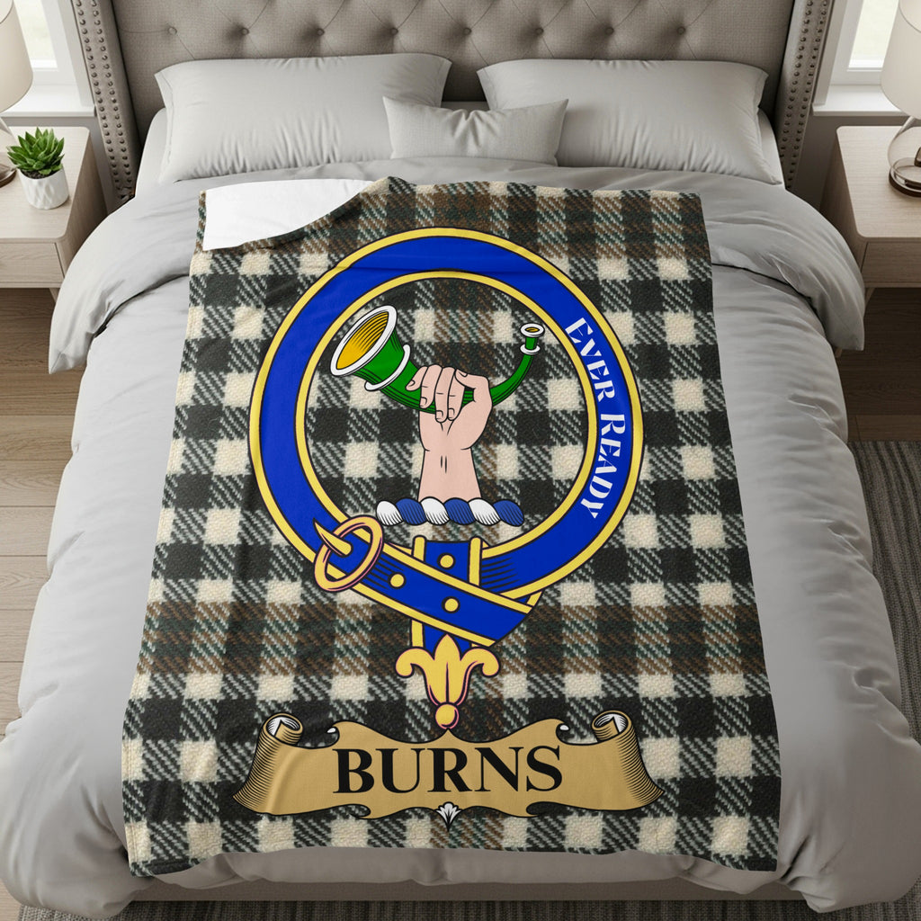 Burns clan crest with hand and horn on tartan throw blanket