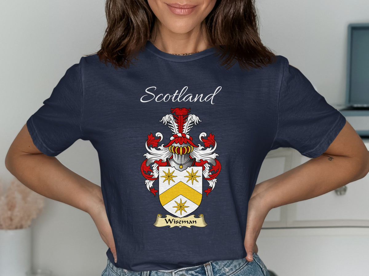 Model wearing the navy Wiseman family crest T-shirt featuring “Scotland” and the surname banner.