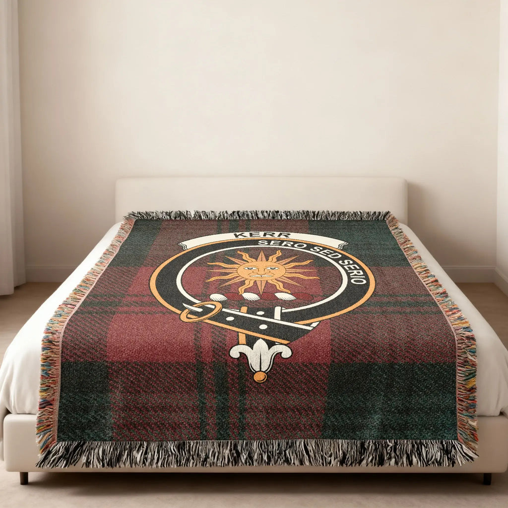 Kerr Sero Sed Serio clan crest tartan woven blanket — heraldic design at centre, fringe edge visible