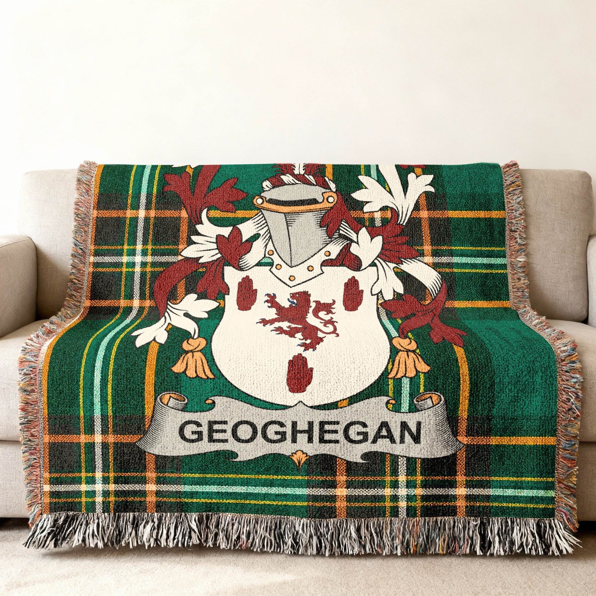 Green tartan blanket with Geoghegan coat of arms and crest.