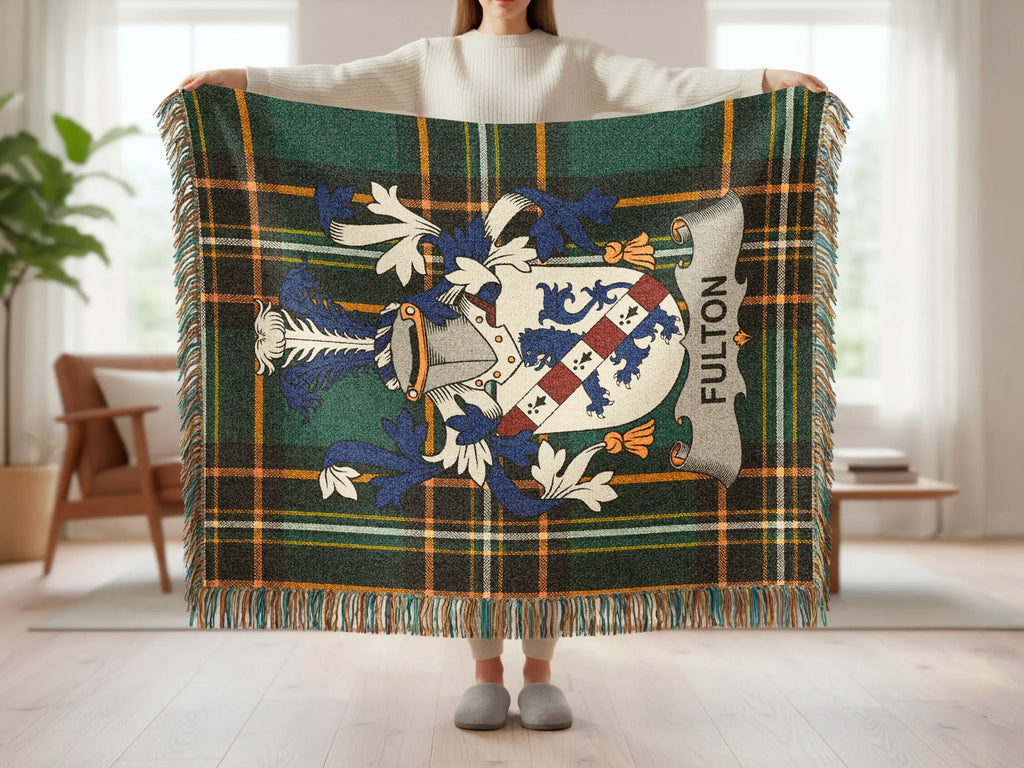 Tartan throw blanket with FULTON family crest and fringe.