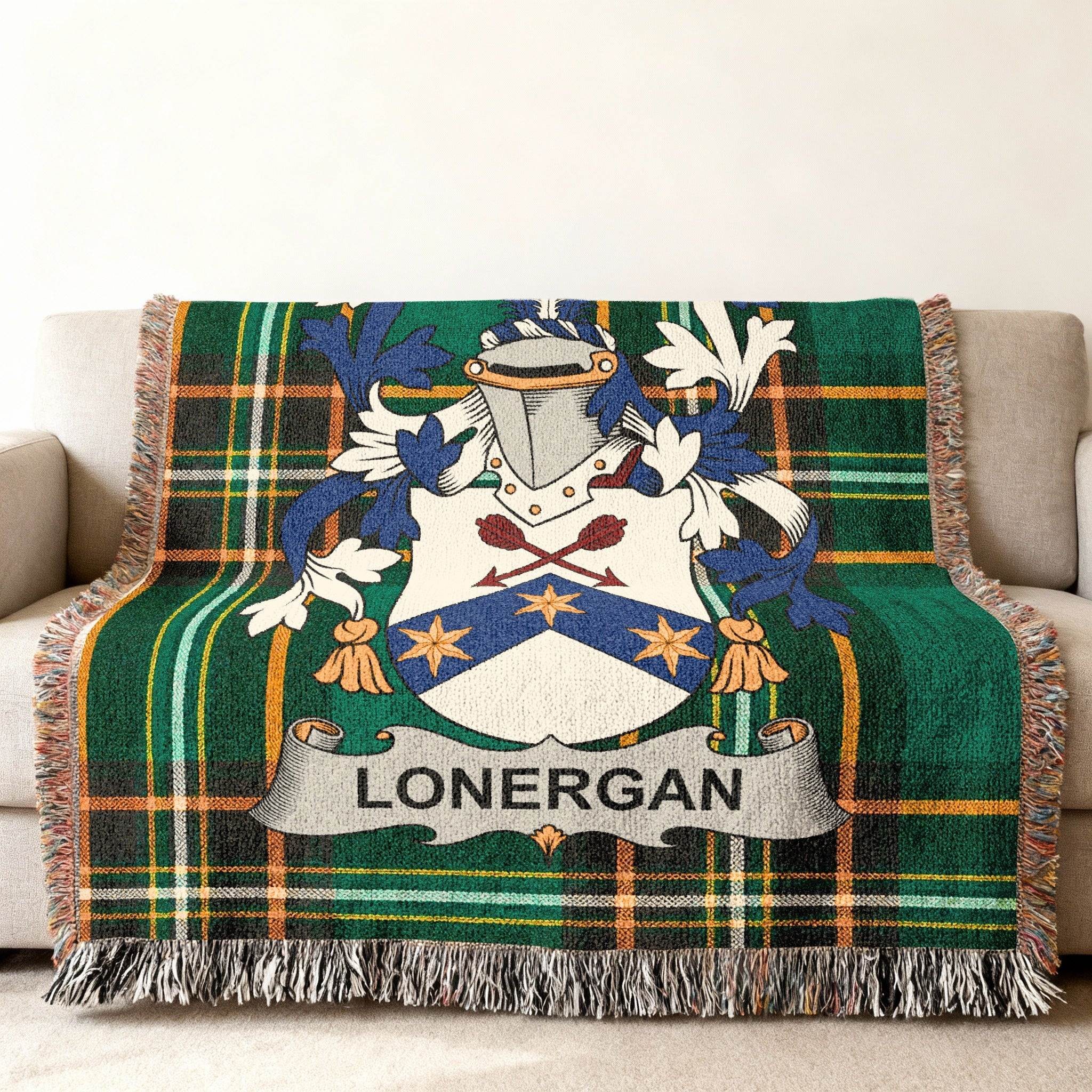 Woven tartan blanket with Lonergan family crest centered on a sofa.