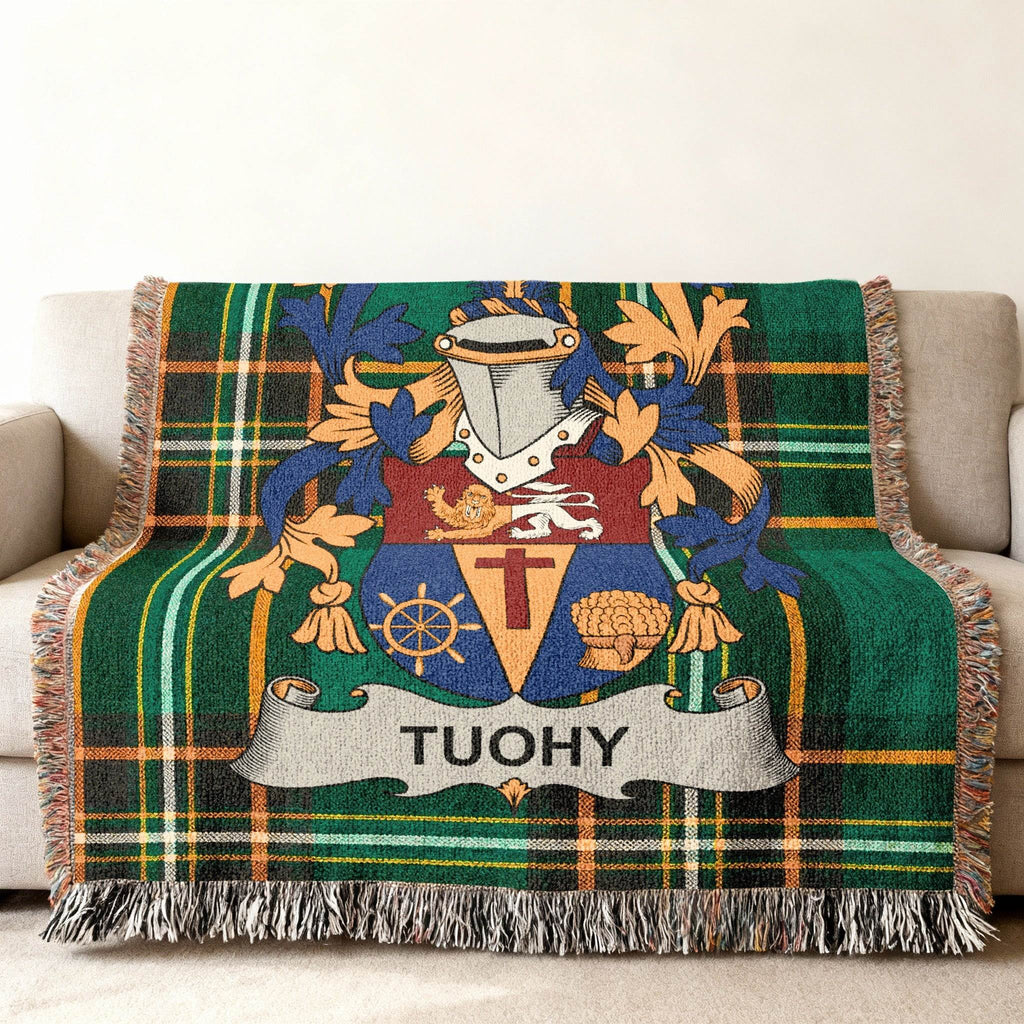 Tuohy family crest on a green tartan woven blanket.