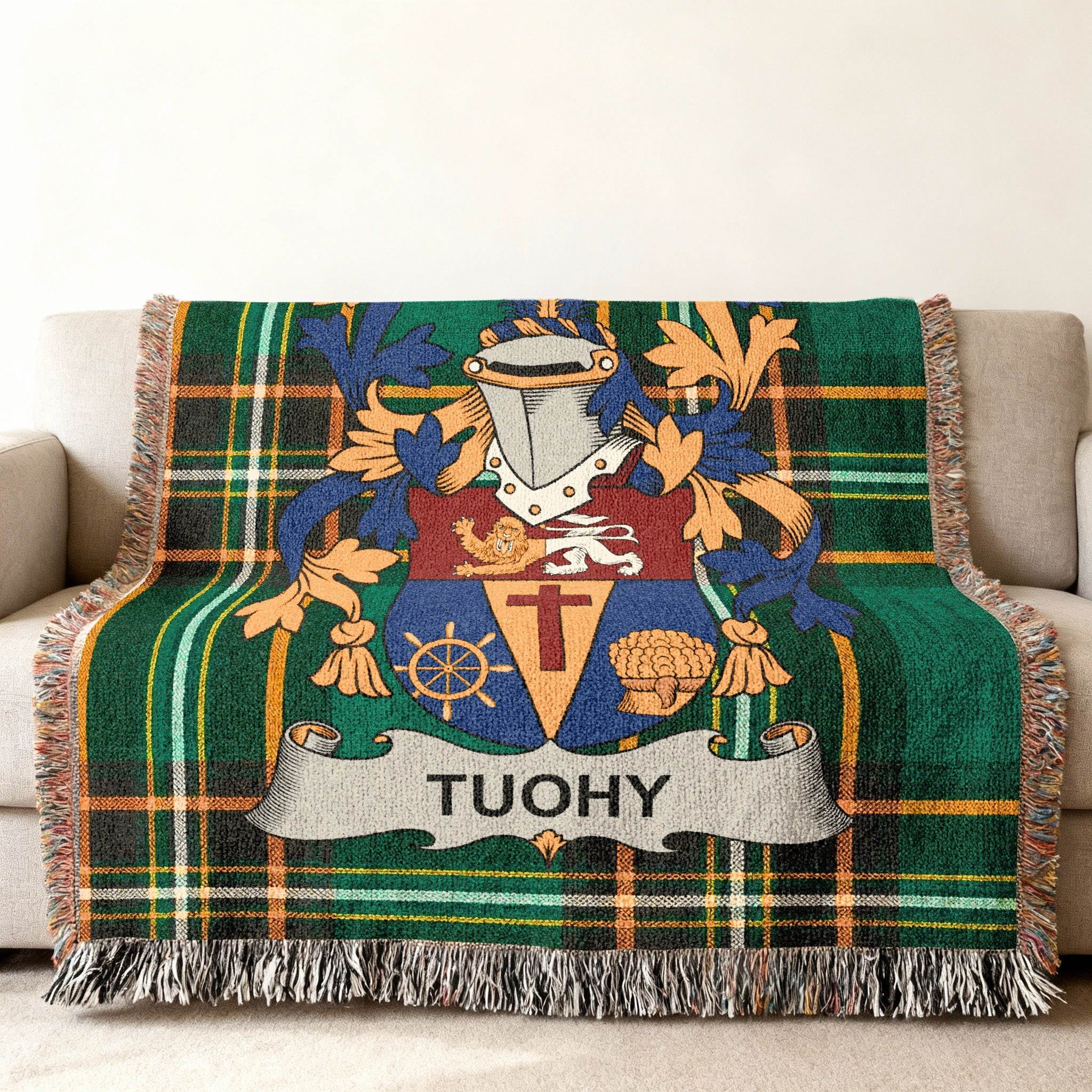 Tuohy family crest on a green tartan woven blanket.