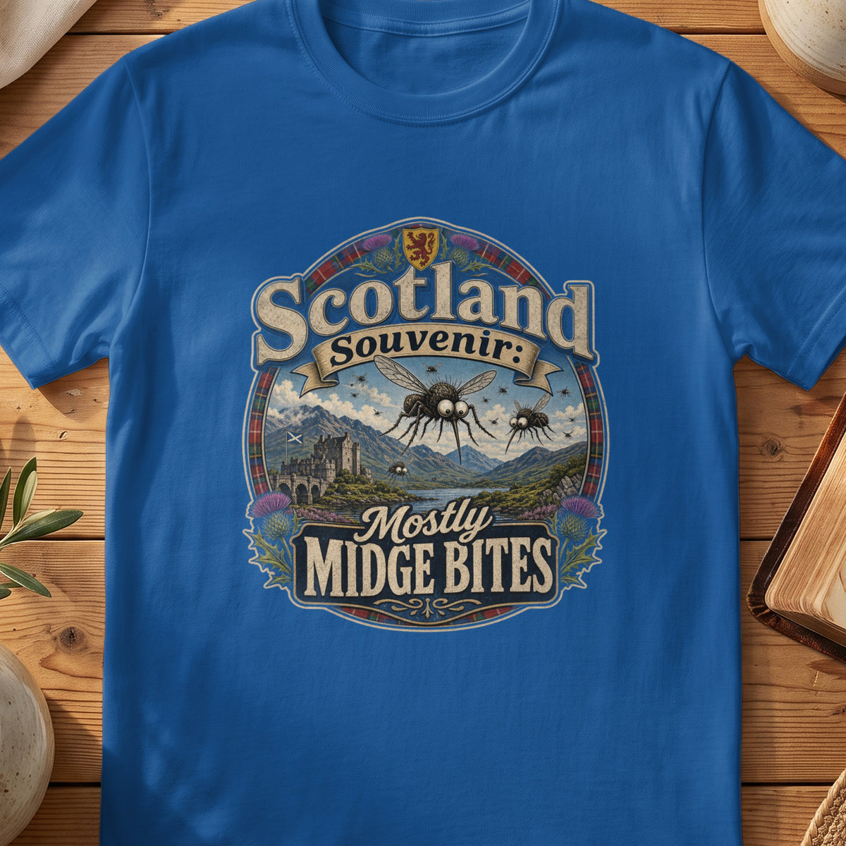 Scotland souvenir t-shirt with "Mostly Midge Bites" text and Scottish scenery.