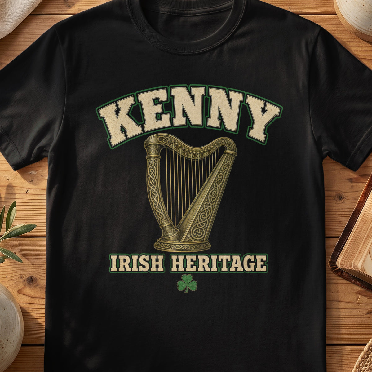 Kenny Irish harp T-shirt in Black, with cream surname lettering, a gold-toned harp, green shamrock and “Irish Heritage” text.